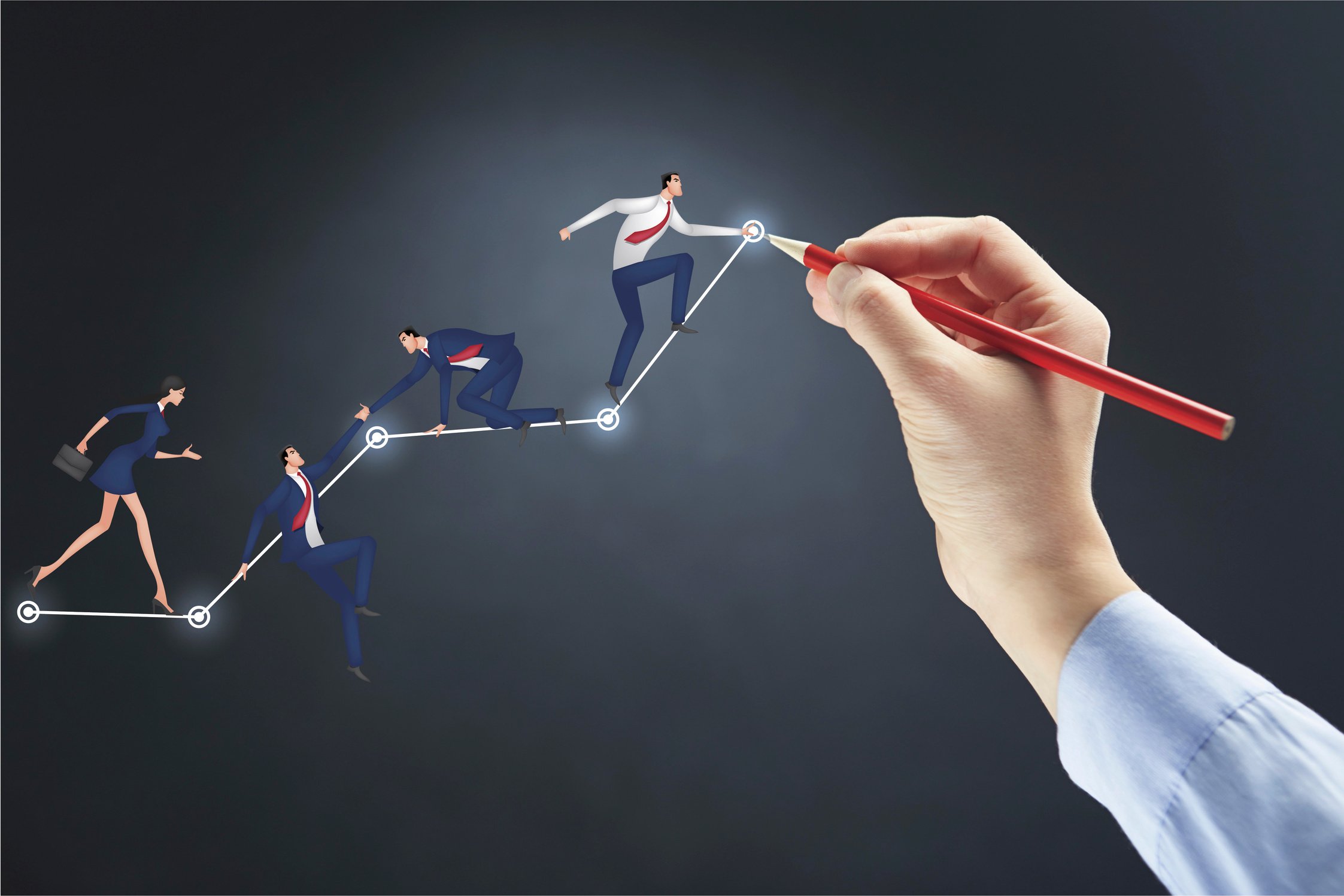 Hand holding pencil with teamwork concept